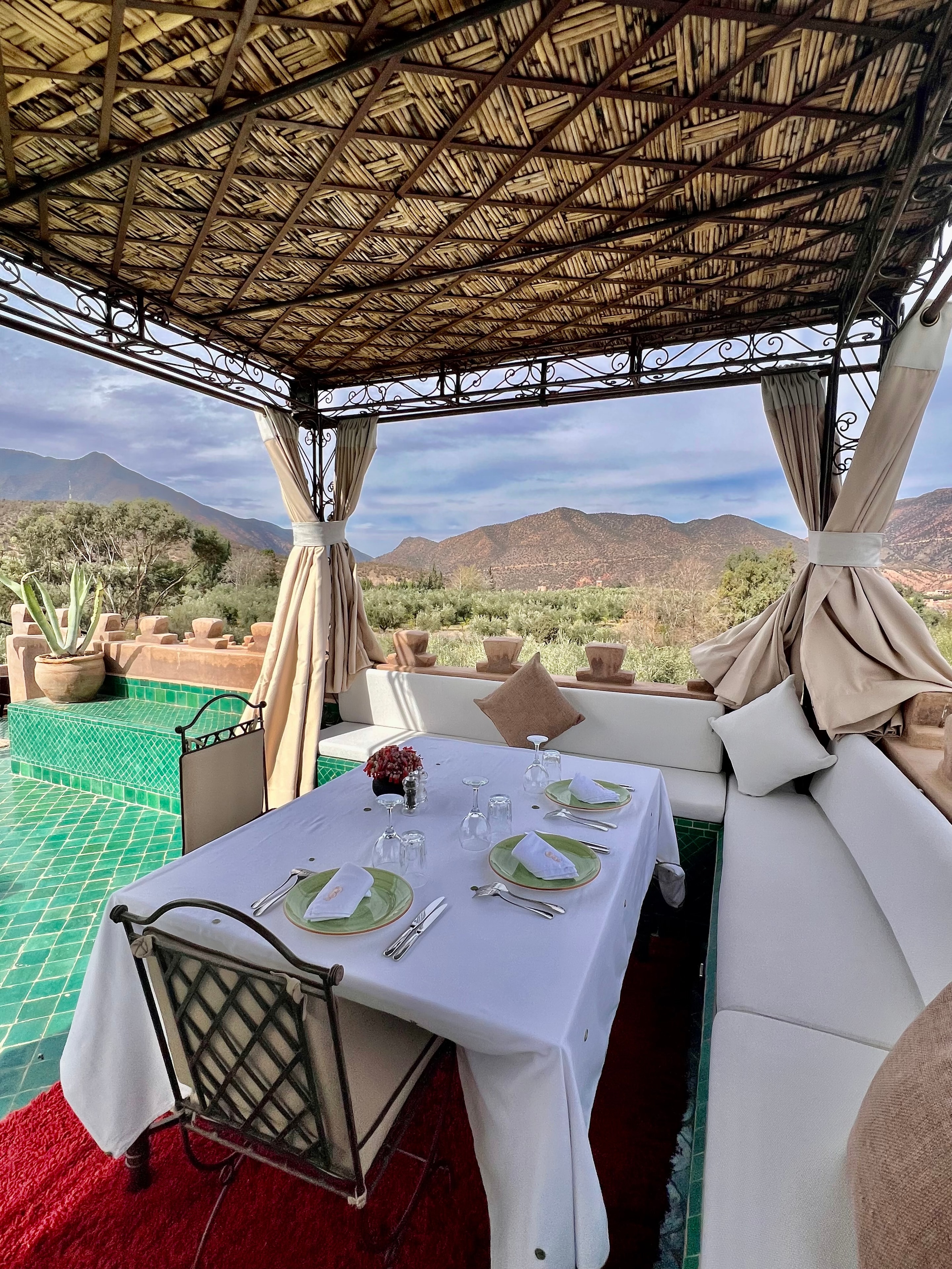 Elegant outdoor dining pavilion overlooking the Atlas Mountains