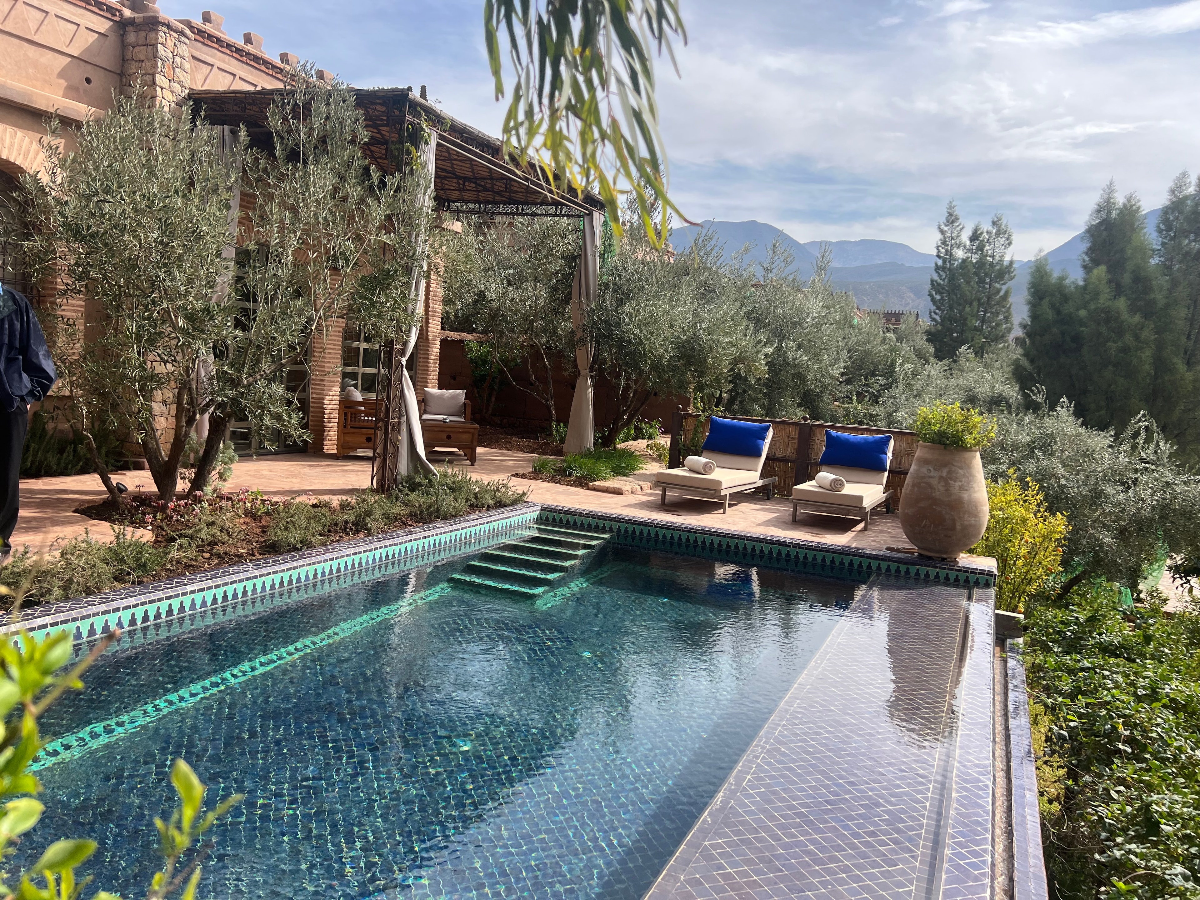Luxury mosaic pool with mountain views at a Moroccan retreat