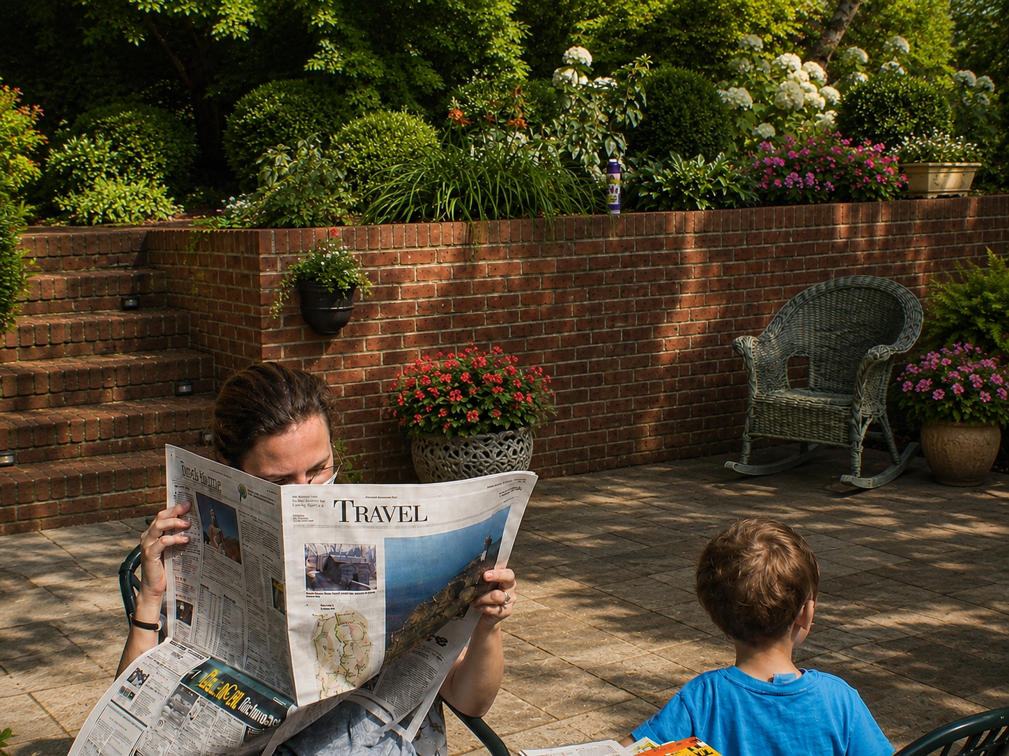 Young Cindy reading the Travel section of the newspaper on a garden patio with her child